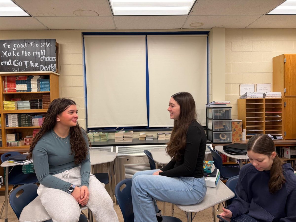 Freshman Harper Seiler talks with classmate Sophie Lovrich before class during homeroom.