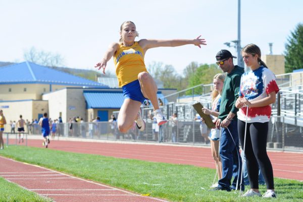 Ella Cherry hits the pit on one of her jumps in the long jump competition at the B-A Invitational. Cherry won the long and triple jumps and took first in the 100 meters before being named the meet's outstanding jumper.