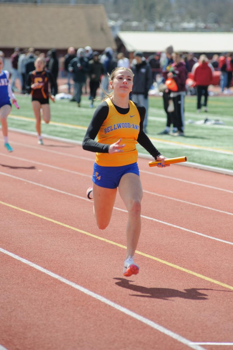 Ella Cherry runs a leg of the 4x100 relay at the Mountain Lion Classic.