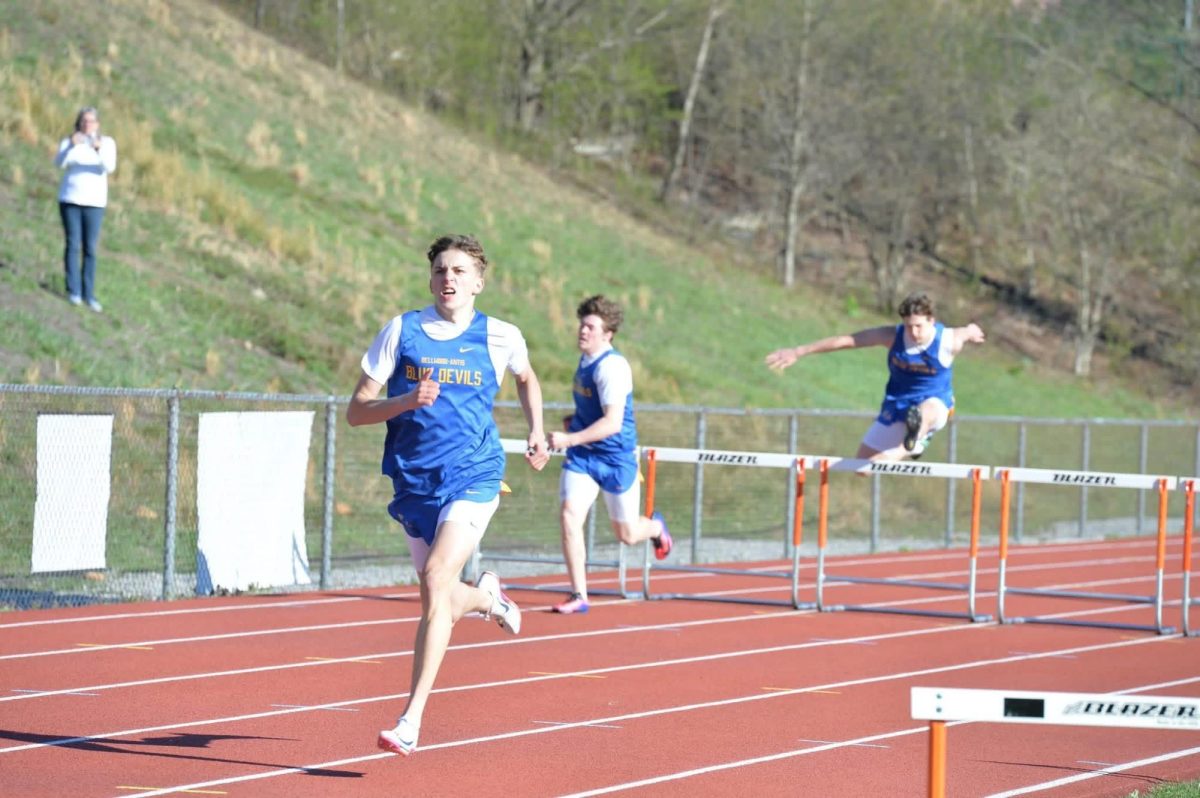 Cameron Nelson established a new record in the 300 hurdles on Tuesday, breaking a mark set by his current coach.