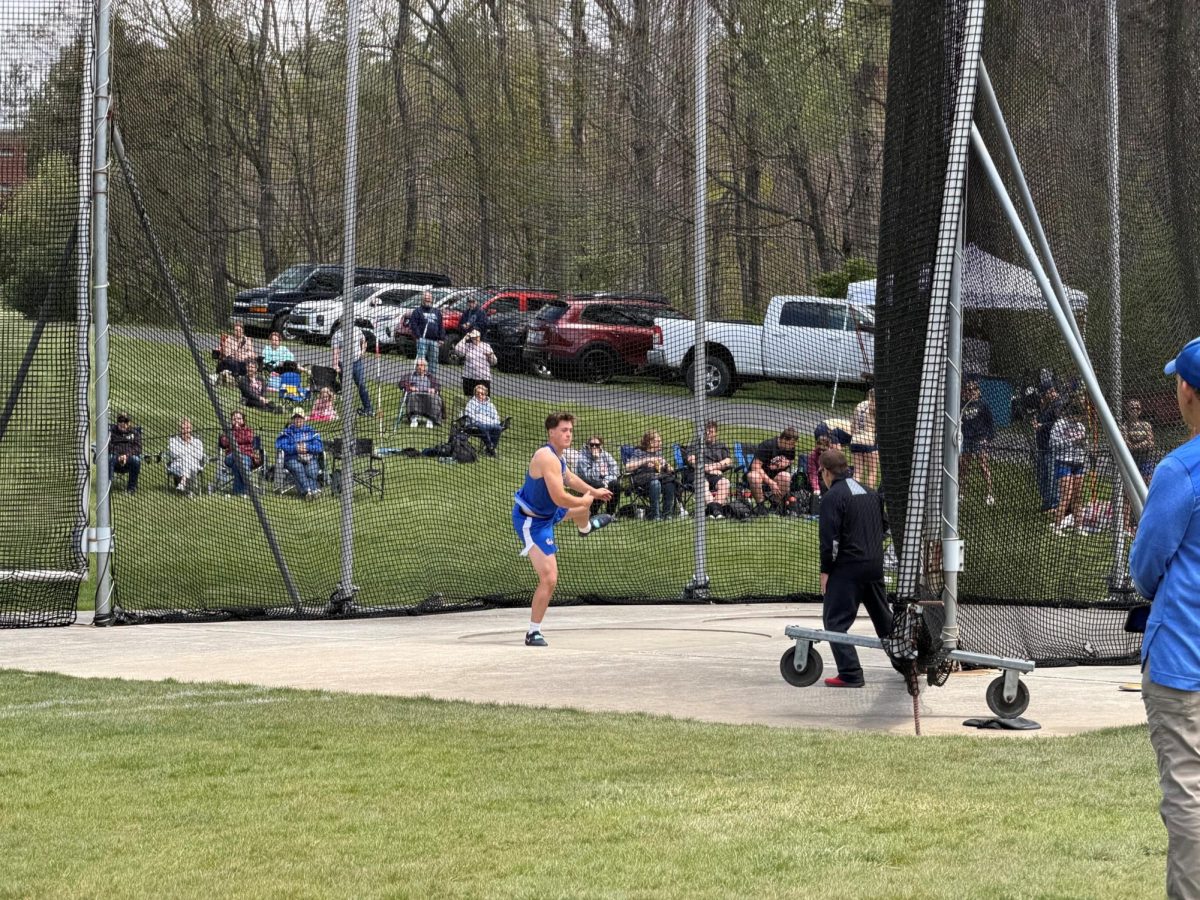 Jayce Quick follows through on his throw in the discus event at the LHAC championships at Saint Francis on May 5. Quick finished third with a throw of 141-4.